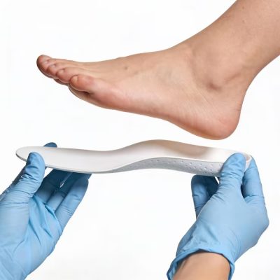 imgi_30_person-is-holding-shoe-with-white-sole-blue-glove_1179211-6296